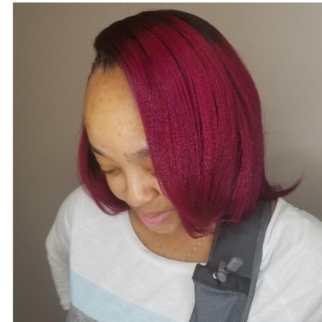 Magenta silk-press bob with a dark root, styled by Patrice Dash