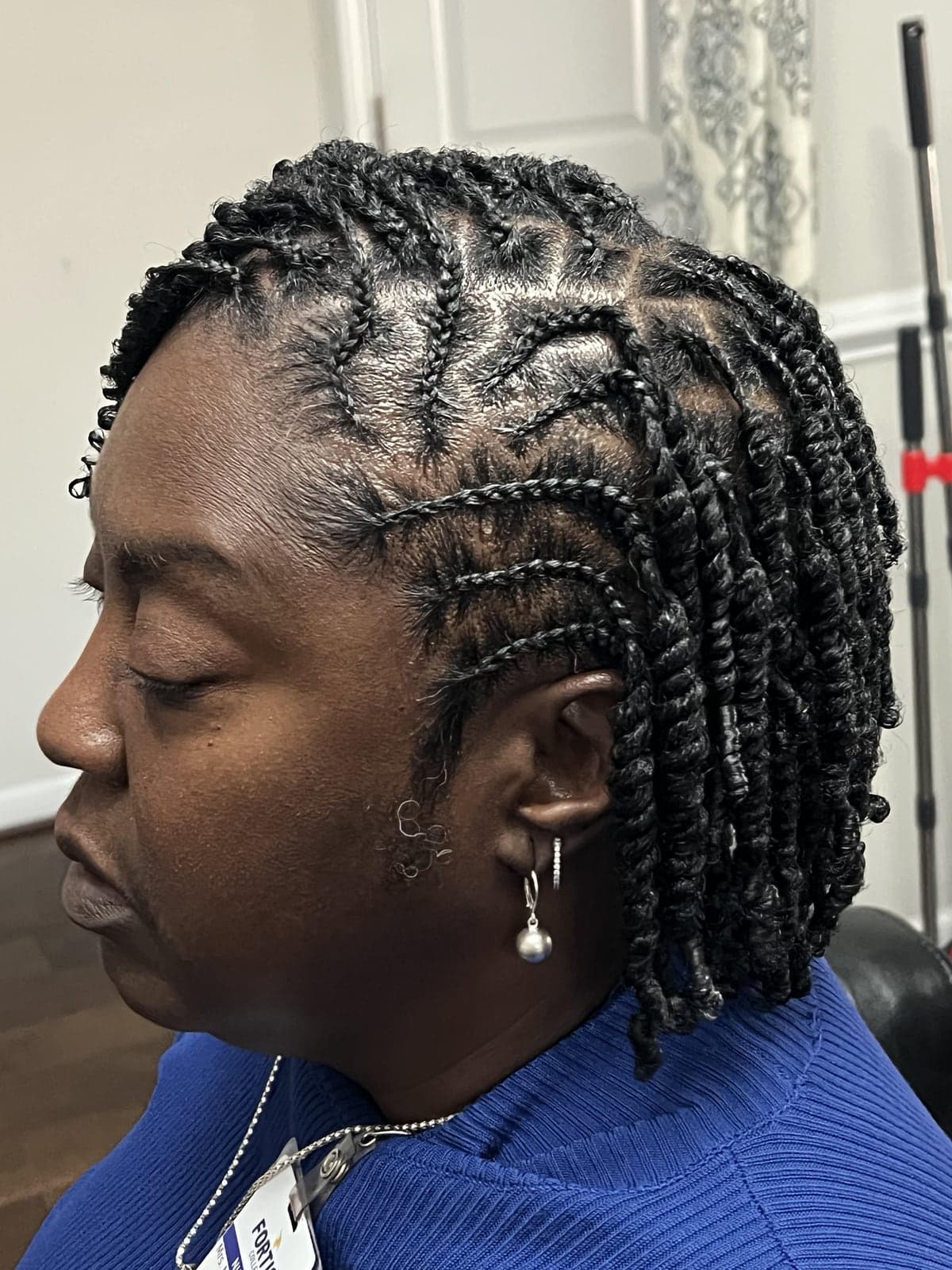 Mini two-strand twists on natural hair, side view