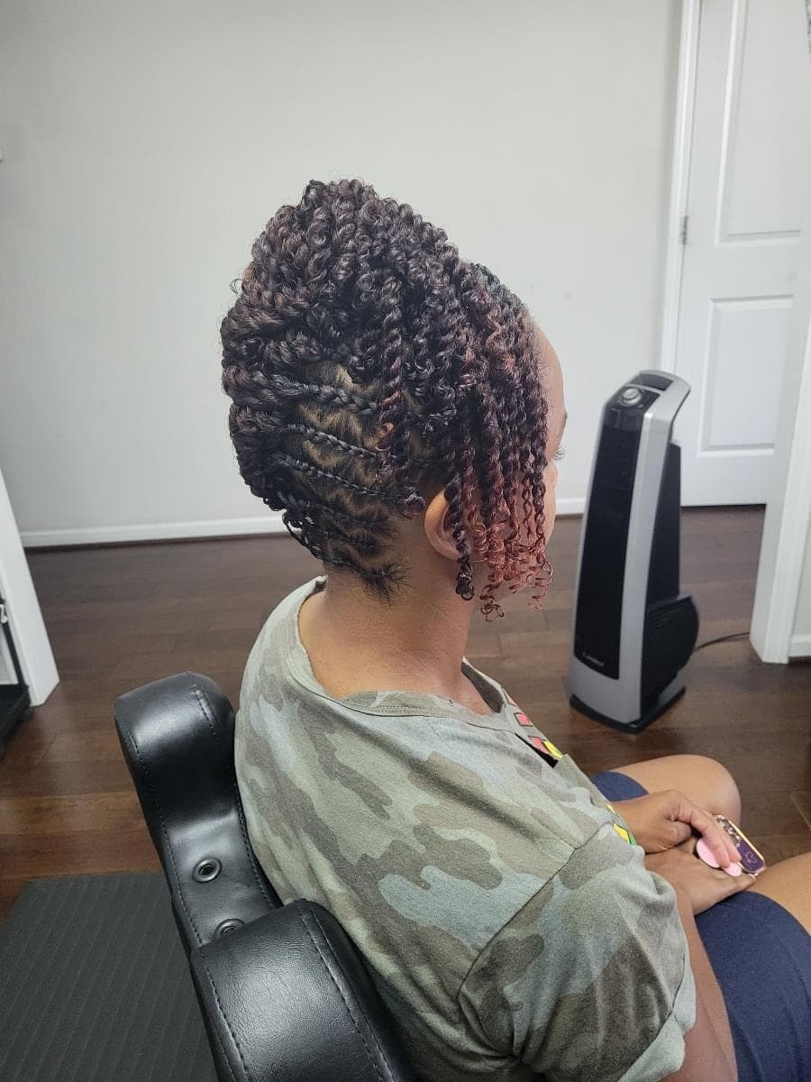 Two-strand twist updo with burgundy tips by Patrice